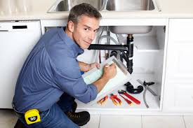 Picture of a Brooklyn emergency plumbing technician fixing a sink